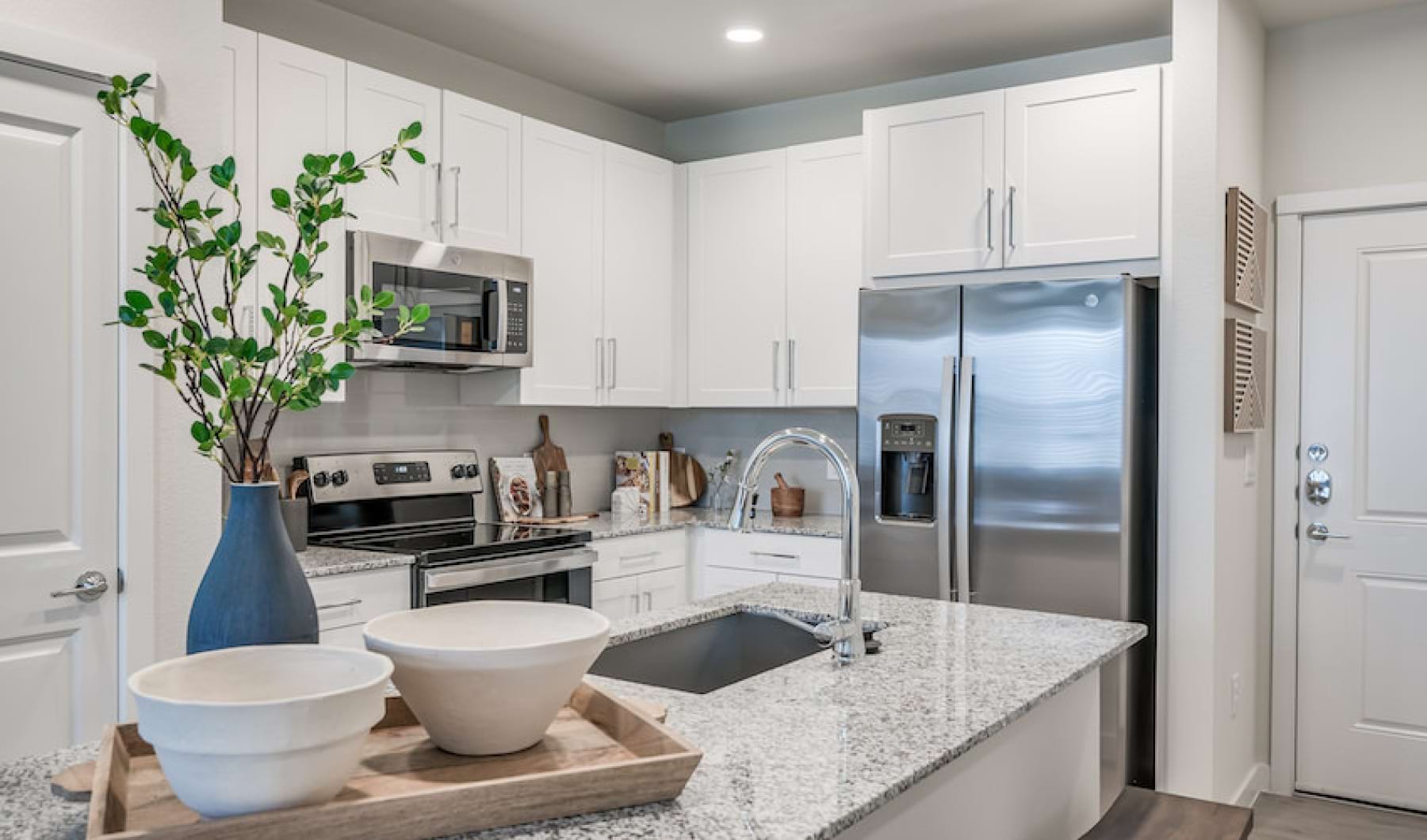 Kitchen with large Island and barstools at prose hardy yards in houston, tx Kitchen with large Island and barstools at prose hardy yards in houston, tx