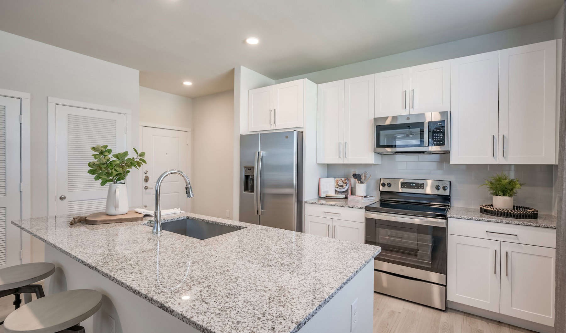 Open Concept Island Kitchen inside of a luxury apartment in houston